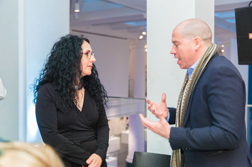 Exhibition curator Cecilia Fajardo-Hill (left) speaks with Director of CONTEXT Art Fair Julián Navarro (right)  at the luncheon reception honoring Radical Women. Brooklyn Museum, April 12, 2018