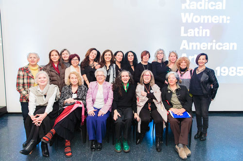 Radical Women artists and curators at the luncheon reception. Standing, from left to right: unknown guest,  Rosa Novarro, Poli Marichal, María Evelia Marmolejo, Analívia Cordeiro, curator Andrea Giunta, Janet Toro, curator Cecilia Fajardo-Hill, Graciela Carnevale, Sylvia Palacios Whitman, Victoria Cabezas, Josely Carvalho, Eugenia Vargas Pereira. Seated, from left to right: Carla Rippey, Anna Bella Geiger, Delfina Bernal, Ani Villaneuva, Sandra Llano-Mejia, Catalina Parra. Brooklyn Museum, April 12, 2018