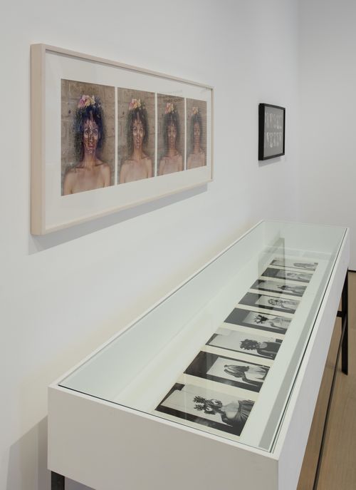 Self-Portrait gallery. On wall: works by Sylvia Salazar Simpson and Regina Vater; in vitrine: photographs by Sylvia Salazar Simpson. Installation view at the Hammer Museum, Los Angeles
