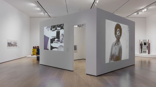 Self-Portrait gallery. Projected onto walls, from left to right: Narcisa Hirsch, Taller (Workshop), 1975, and Victoria Santa Cruz, Me gritaron negra (They shouted black at me), 1978. Installation view at the Hammer Museum, Los Angeles

