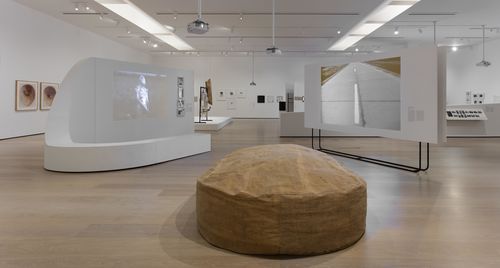 Resistance and Fear gallery. Foreground, on floor: Carmela Gross, Presunto (Ham [slang for corpse]), 1968; on walls, from left to right: María Evelia Marmolejo, Anónimo 4 (Anonymous 4), 1984, and Anónimo 1 (Anonymous 1), 1981, and Lotty Rosenfeld, Una milla de cruces sobre el pavimento (A mile of crosses on the pavement), 1979. Installation view at the Hammer Museum, Los Angeles