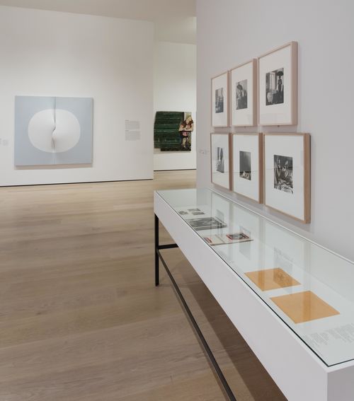 The Erotic gallery. Foreground, on wall: Kati Horna, six untitled photographs from the series Oda a la necrofilia (Ode to necrophilia), 1962; in vitrine, from left to right: works by Márcia X and Alex Hamburger, and works by Cecilia Vicuña. Installation view at the Hammer Museum, Los Angeles