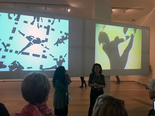 Curator Cecilia Fajardo-Hill (left) and artist Analívia Cordeiro (right) in front of two of Cordeiro's video works at the Radical Women artists' walkthrough. Hammer Museum, Los Angeles