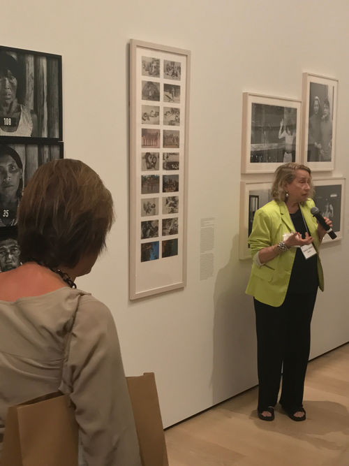 Artist Anna Bella Geiger in front of Brasil nativo, Brasil Alienígena (Native Brazil/Alien Brazil), 1977, at the Radical Women artists' walkthrough. Hammer Museum, Los Angeles