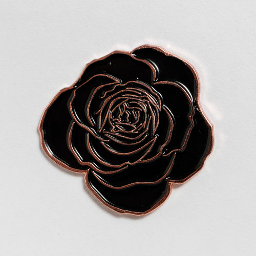 Black rose-shaped enamel pin. Hammer Museum, Los Angeles 
