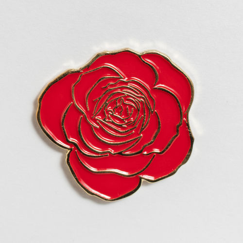 Red rose-shaped enamel pin. Hammer Museum, Los Angeles 
