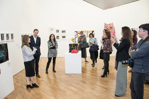 Chief curator Valéria Piccoli (far left) speaks during an opening day tour of Radical Women. Pinacoteca de São Paulo, August 18, 2018
