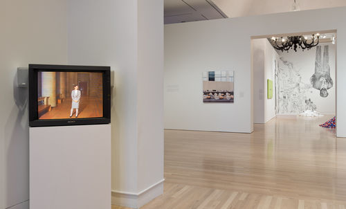 Foreground: Andrea Fraser, "Museum Highlights: A Gallery Talk," 1989; background: works by  Louise Lawler, Jenny Holzer, Felix Gonzalez-Torres, Rirkrit Tiravanija, and Fred Wilson. Installation view at the Hammer Museum, Los Angeles 