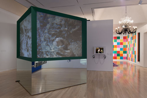 Foreground: Judith Barry, "Imagination, Dead Imagine," 1991; right: Judith Barry, "Casual Shopper," 1980–81; next gallery: works by Fred Wilson, Felix Gonzalez-Torres, and Jenny Holzer. Installation view at the Hammer Museum, Los Angeles