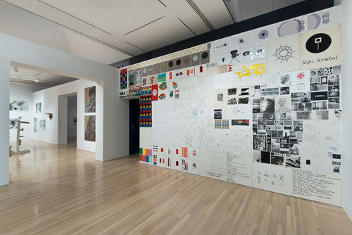 Matt Mullican, "7 1/2 Bulletin Boards," 2013; in next gallery, works by Jimmie Durham, Zoe Leonard, Sherrie Levine, and John Miller. Installation view at the Hammer Museum, Los Angeles