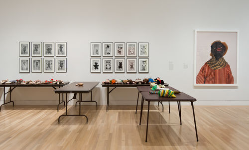 From left to right: Mike Kelley, "Craft Morphology Flow Chart," 1991, and Fred Wilson, "Slit," 1995. Installation view at the Hammer Museum, Los Angeles