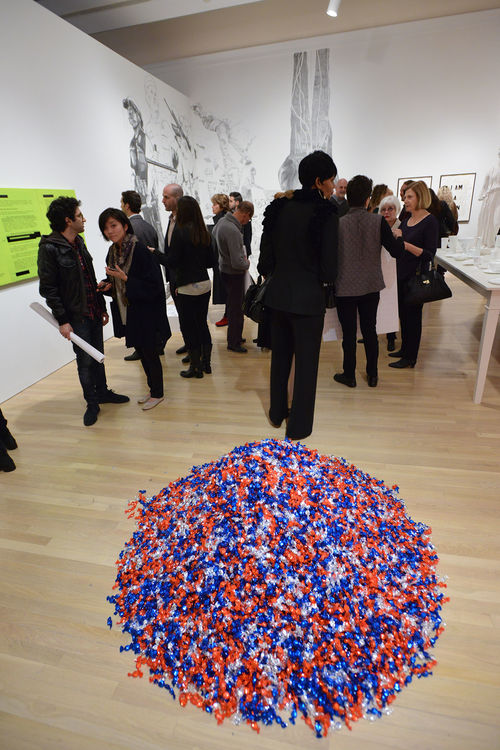 Guests in gallery during the opening of "Take It or Leave It," Felix Gonzalez-Torres, "Untitled (USA Today)," 1990 in foreground, Hammer Museum, Los Angeles, February 8, 2014