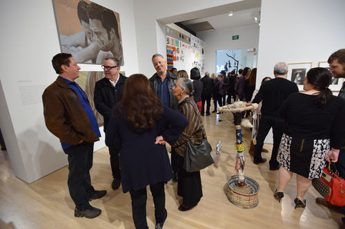 Artist Matt Mullican (second from left, in glasses) and guests in gallery during the opening of "Take It or Leave It," Hammer Museum, Los Angeles, February 8, 2014