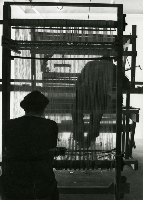 Two students weaving on a rug loom, n.d. Photo by John Stix.