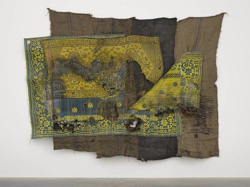 Ibrahim Mahama, ALIJA X, 2015-2016. Sleeping prayer mats melted on coal sacks, 90 9/16 × 114 9/16 in. (230 × 291 cm). Hammer Museum, Los Angeles. Purchased with funds provided by Beth Rudin DeWoody. ©Ibrahim Mahama