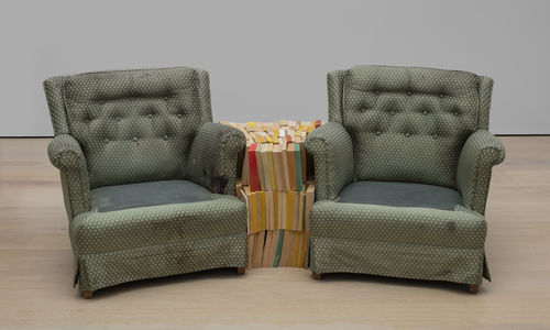 Rodney McMillian, Chairs and Books, 2004. Found armchair, found books. Dimensions variable. Hammer Museum, Los Angeles. Gift of Peter Norton. © 2004 Rodney McMillian