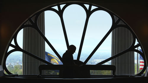 John S. Adams silhouetted in the Montana Capitol building, from DARK-MONEY, a PBS Distribution release