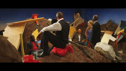 Neïl Beloufa. Still from Production Value, 2013. Mixed-media installation with two-channel video, color, sound. Dimensions variable. 80:00 min. Courtesy François Ghebaly Gallery, Los Angeles, and the artist. Produced by Petit Film with the support of Audi Talents Award in coproduction with Sysmic Films and Turtle Cove.