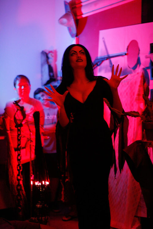 Vincent Ramos, Here the Poets Chop Their Fingers Served Under Glass, 2012. Made in L.A. 2012, installation view, Los Angeles Municipal Art Gallery, Barnsdall Park, Los Angeles, June 2-September 2, 2012. Performance by Christie Lynn Herring. Photo: Charchi Stinson.