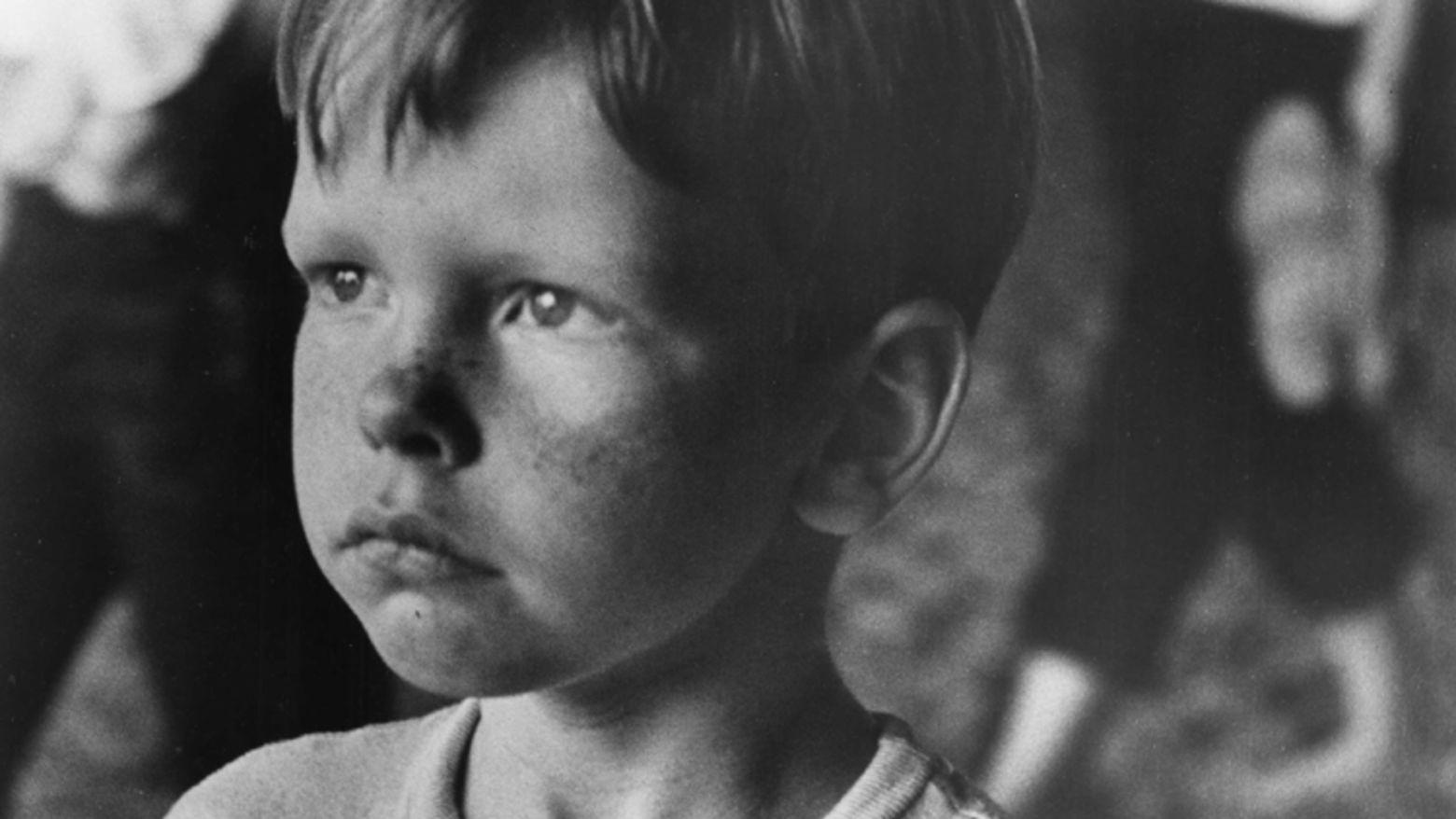 Still from the film Little Fugitive (1953) showing a close-up of a young boy frowning