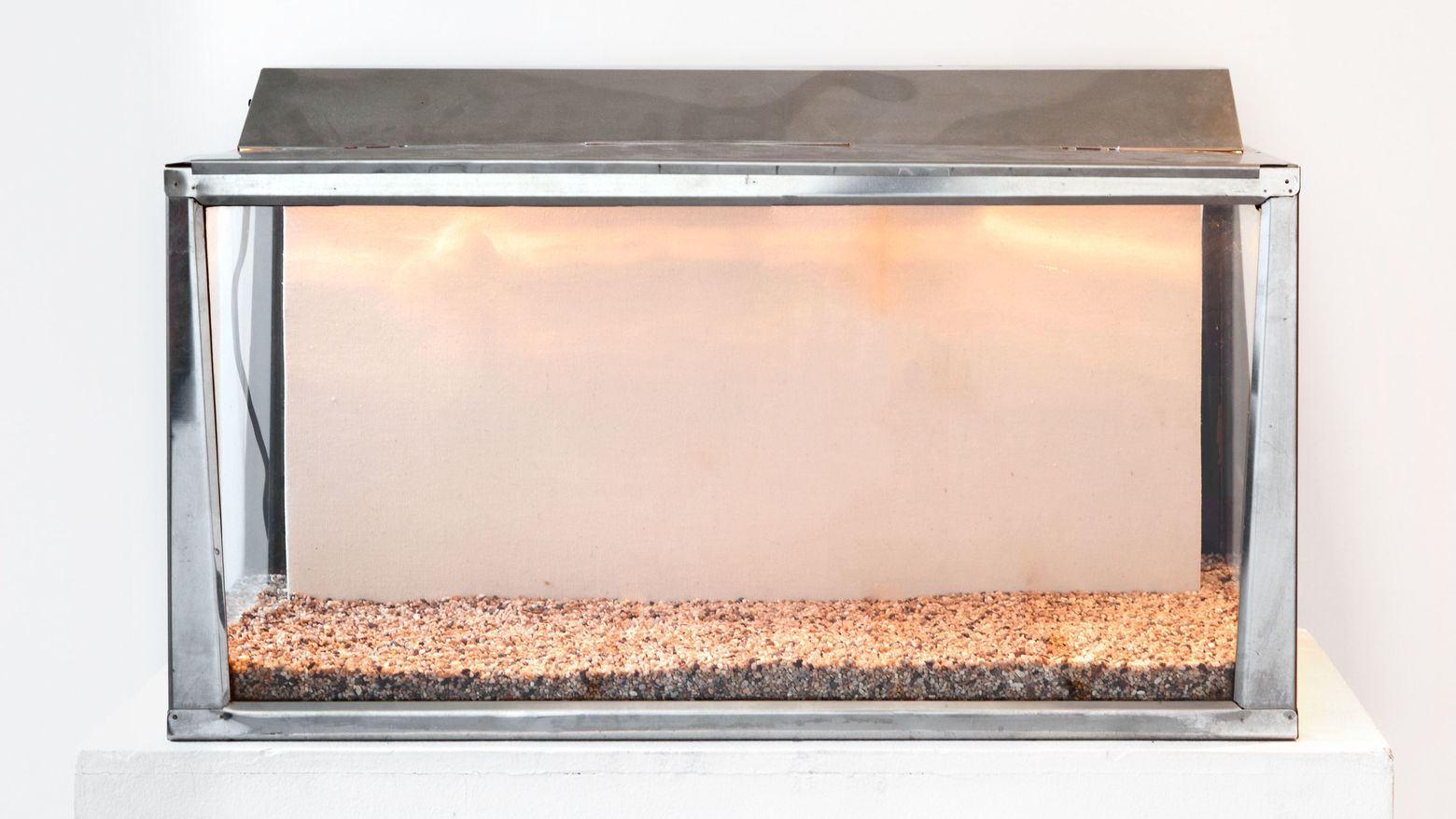 Allen Ruppersberg, Untitled (Canvas Aquarium), 1968. Glass aquarium with light; canvas panel, feather, rocks. Courtesy Greene Naftali, New York; photo: Martha Fleming-Ives.