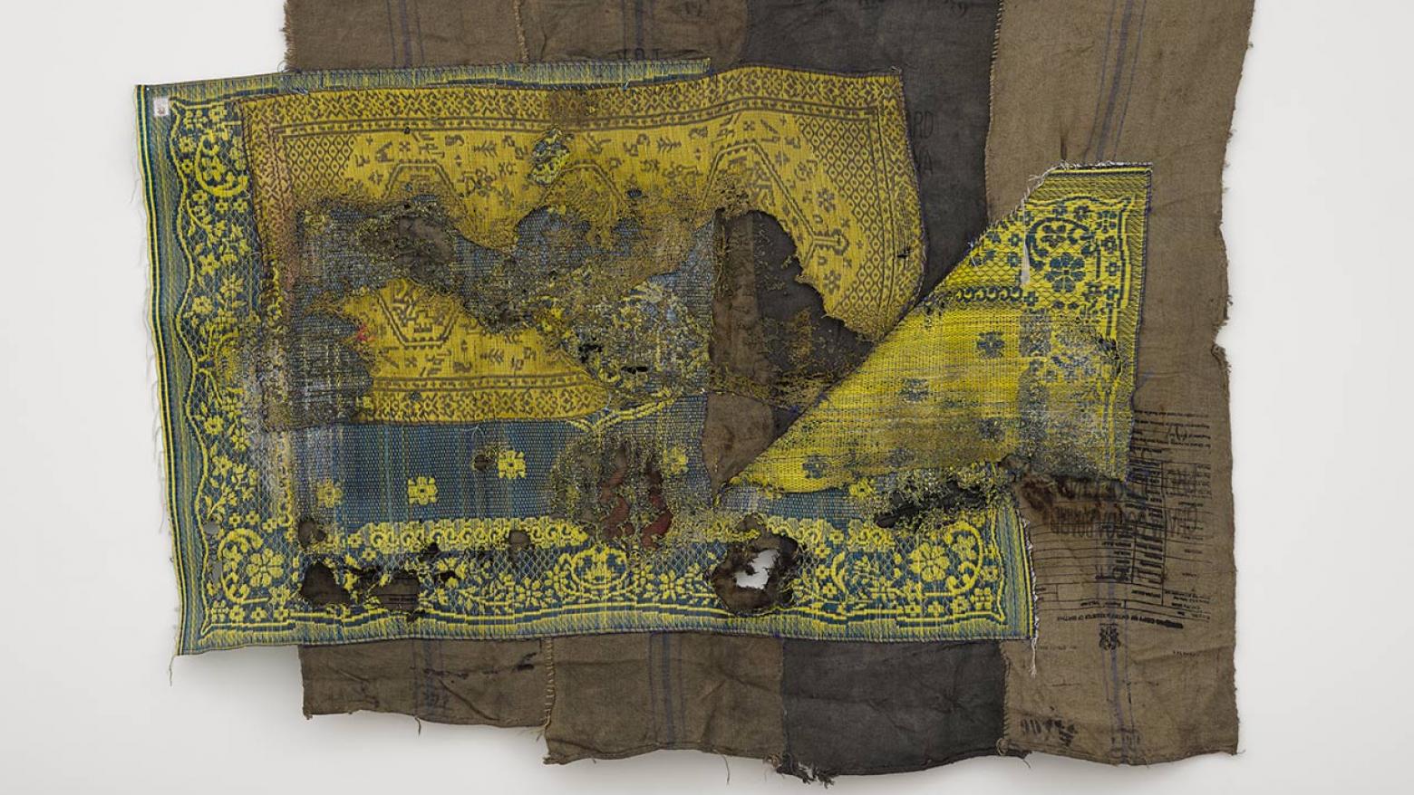 Ibrahim Mahama, ALIJA X, 2015-2016. Sleeping prayer mats melted on coal sacks, 90 9/16 × 114 9/16 in. (230 × 291 cm). Hammer Museum, Los Angeles. Purchased with funds provided by Beth Rudin DeWoody. ©Ibrahim Mahama