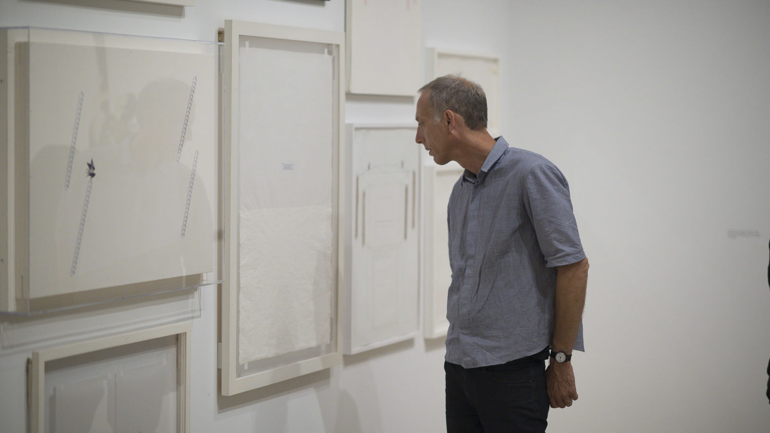 Man looking at art