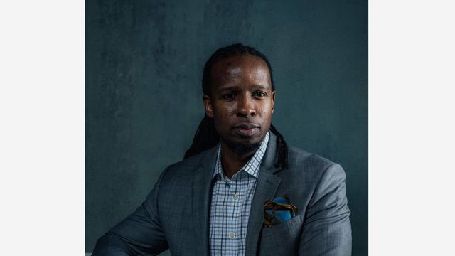 Portrait photograph in color of Ibram X. Kendi