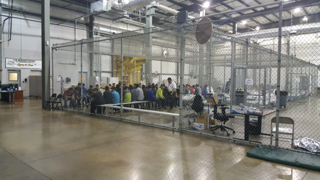 Detainees in a fenced in area inside a detention facility in McAllen, Texas. 