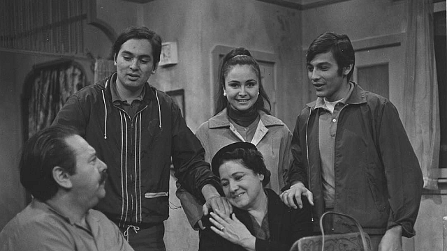 Still from the first episode of the television show Canción de la Raza (Song of the People) (1968), showing a Chicanx family gathered around a table