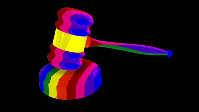 A rainbow-colored gavel