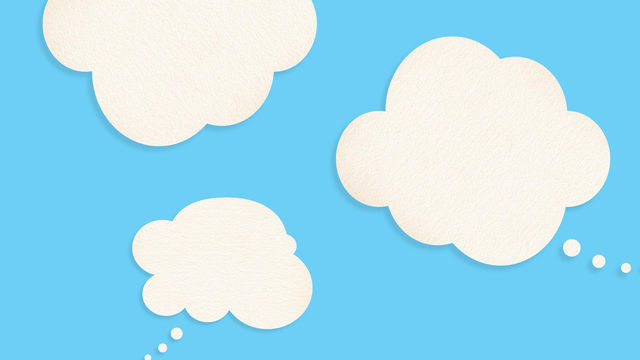 Three white thought bubble clouds on a sky blue background