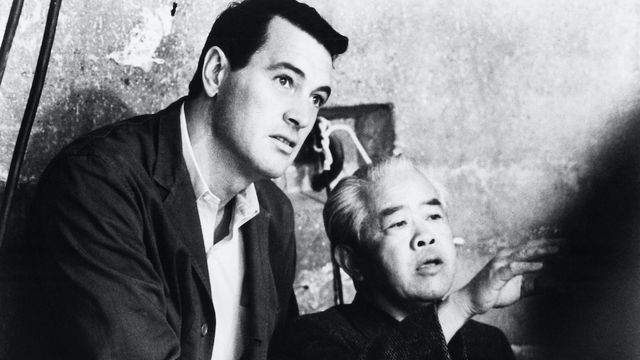 Rock Hudson on the left and James Wong Howe on the right on set. 