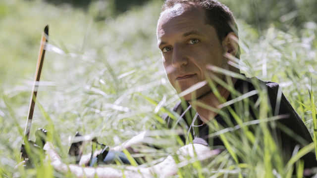 Man in a field of grass.