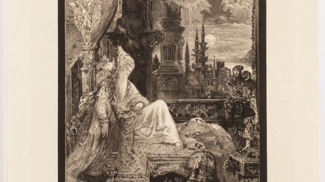 Image of a man with a long beard in extravagant clothing, sitting on an ornate bench in an ornate room. 