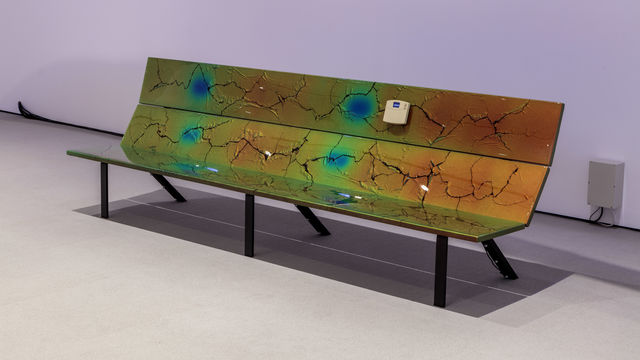 Bench with thermal map design and crackling painted on it.