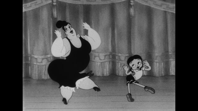 Two cartoon female characters dance on a stage.