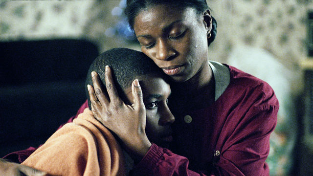A mother holds her young son.