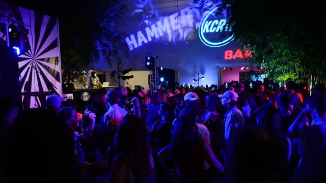 A crowd of concertgoers in the Hammer Museum courtyard