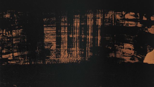 Black and orange paint smeared in large brushstrokes over a tan canvas.