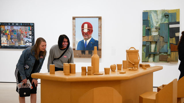 Two women look at an art installation