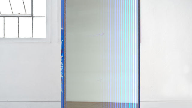 Blue door with lighting around the edges has a fantasy mirror like quality