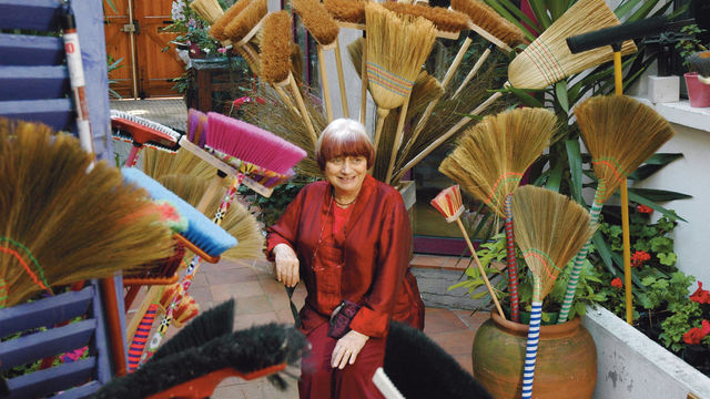 The filmmaker Agnès Varda surrounded by brooms