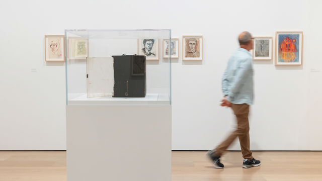 A man viewing art in a gallery