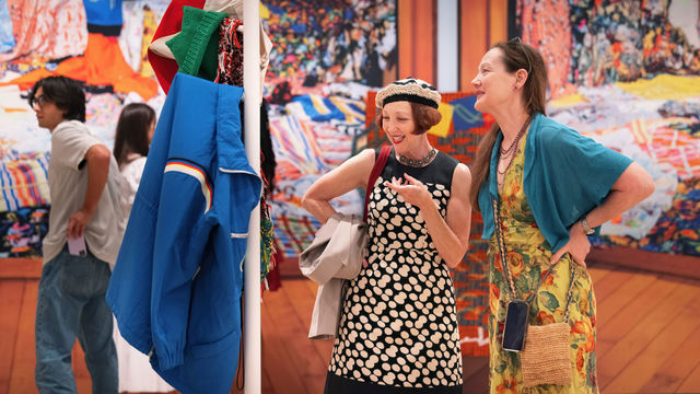 Two women look at an art installation