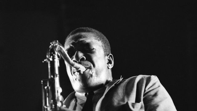 John Coltrane plays his sax