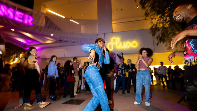 A woman dancing in the Hammer Museum courtyard