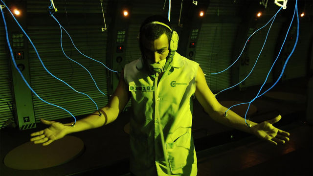 A man wired to a cybernetwork through nodes attached to his arms
