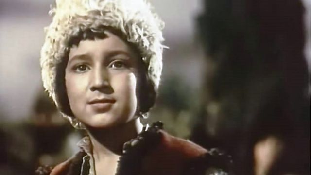 Image of a young boy wearing a furry hat