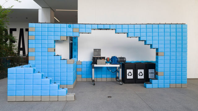 Installation built of blue Water Bricks